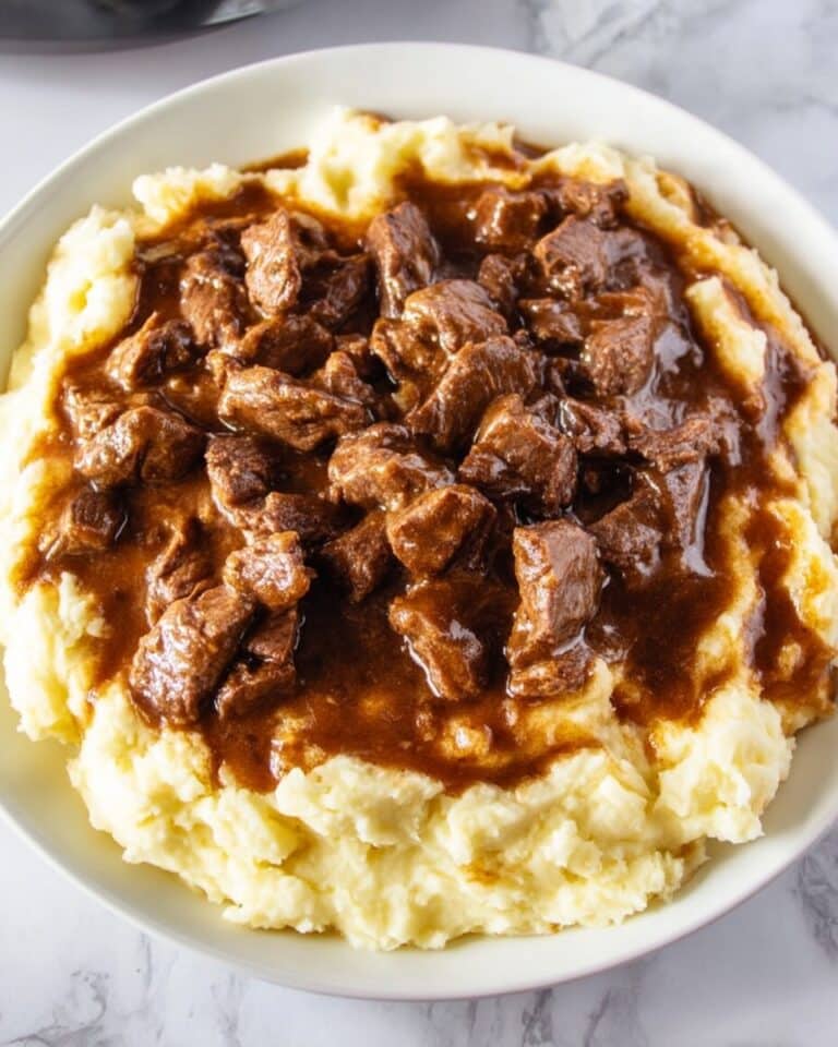 Beef Tips in Rich Gravy Served Over Mashed Potatoes Recipe