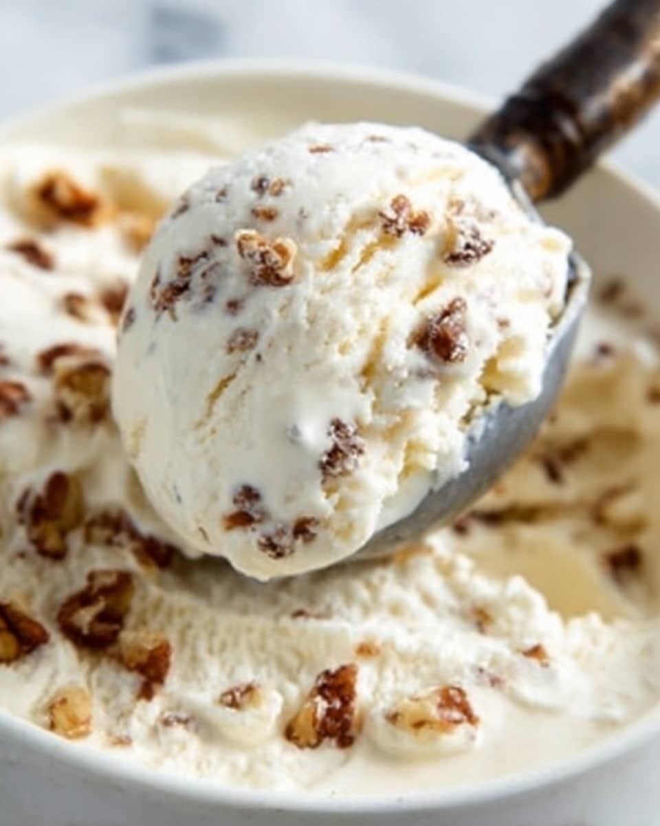 A white bowl filled with five scoops of creamy, off-white ice cream, each scoop showing a smooth yet slightly textured surface, stacked naturally with one scoop resting on top at the center and the others around it. In the background, out of focus, two ice cream cones hold white scoops, with one cone slightly taller than the other. The scene is set on a white marbled surface with a soft, warm wood panel behind, giving a light and fresh look. photo taken with an iphone --ar 4:5 --v 7